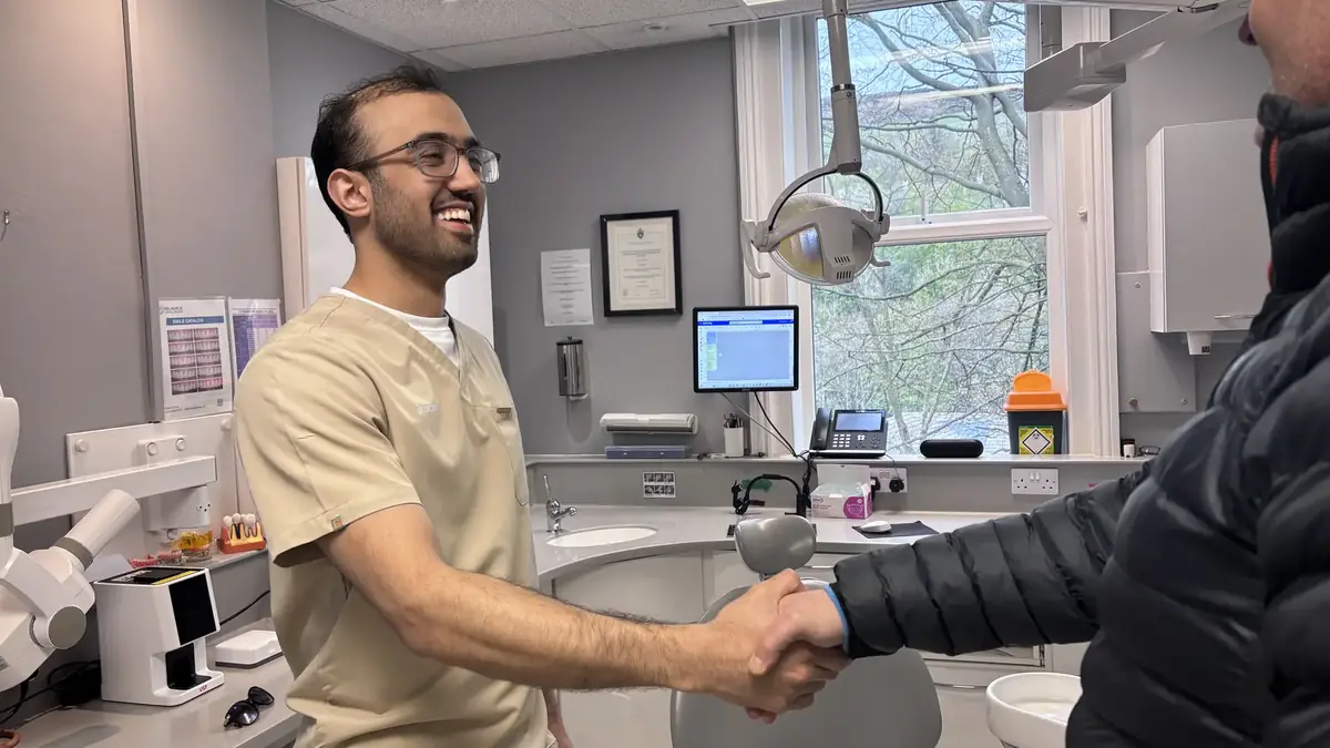 Dr Ijaz welcoming a patient